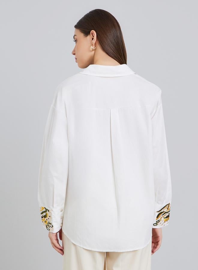 ستايلي بلوزة واسعة بتفاصيل مُطرّزة مع أكمام بأساور - Image 4